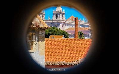 View of cathedral against sky seen through window