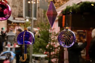 Close-up of christmas decorations hanging on tree