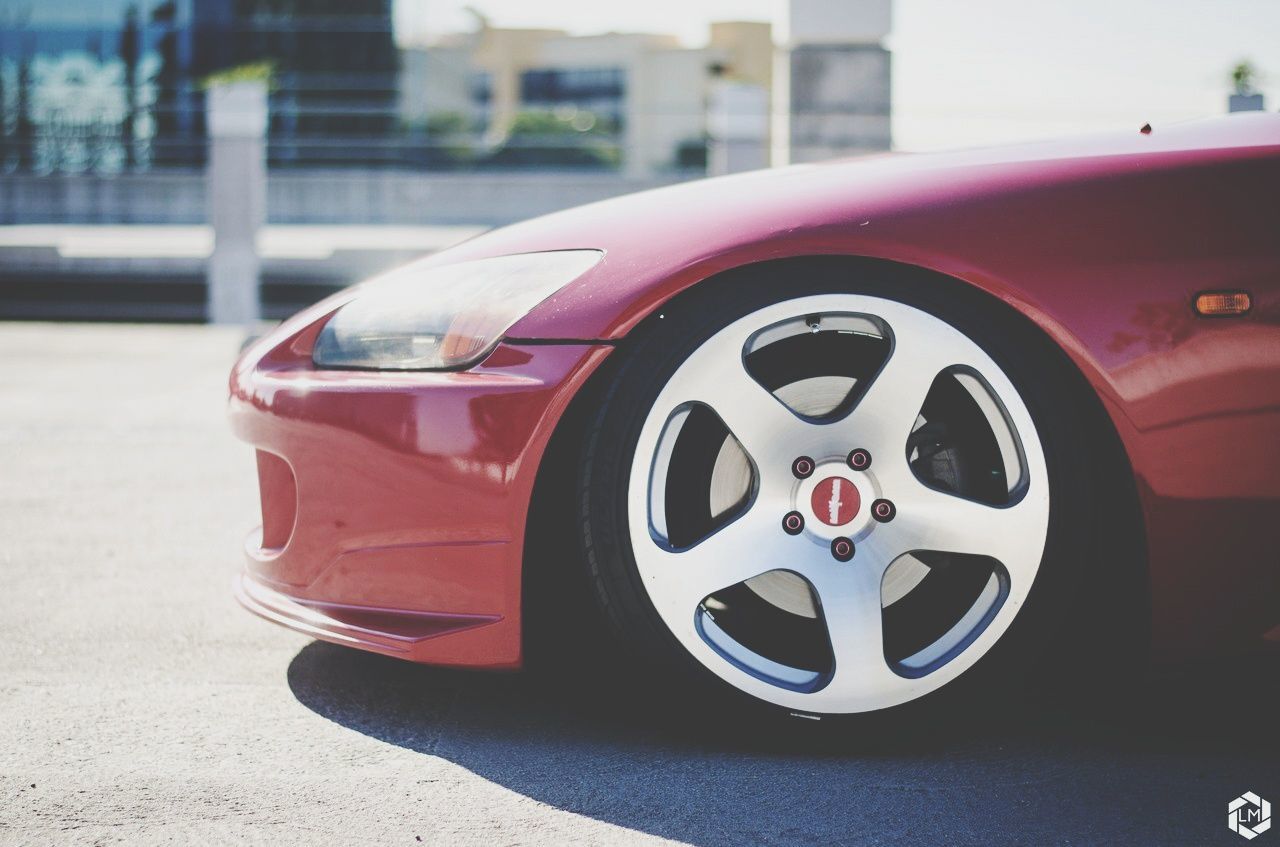 car, transportation, land vehicle, mode of transport, street, red, day, outdoors, sunlight, road, no people, close-up