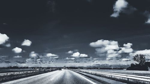 Road amidst landscape against sky