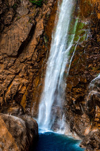 Scenic view of rainbow waterall