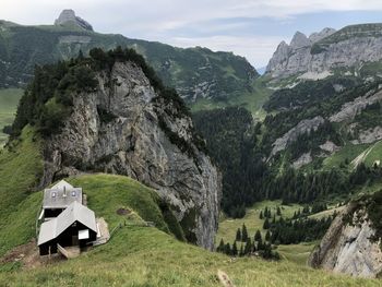 Scenic view of landscape and mountains against sky