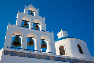 Dome and bell tower of the church of panagia platsani located in oia city at santorini island