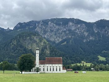 Houses and mountains against sky