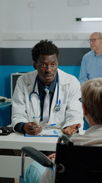 Portrait of female doctor working in office