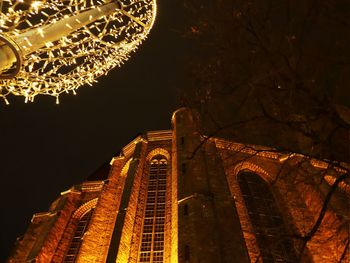 Low angle view of illuminated city at night