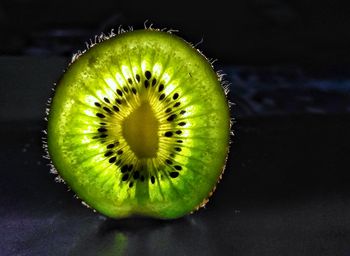 Close-up of lemon slice against black background