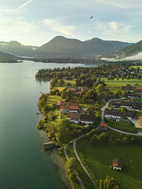 High angle view of sea and mountains against sky