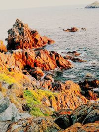 View of rock formation on beach against sky