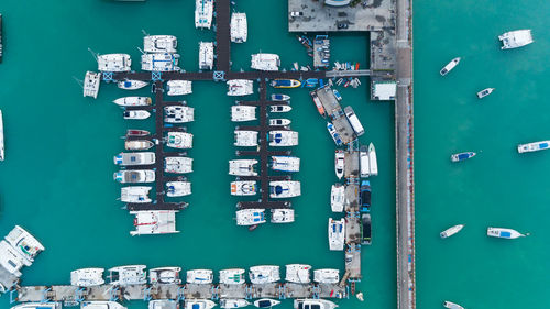 High angle view of information sign on harbor against buildings in city