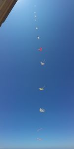 Low angle view of airplane flying in sky