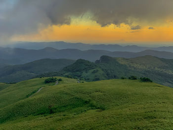 Scenic view of landscape against sky during sunset