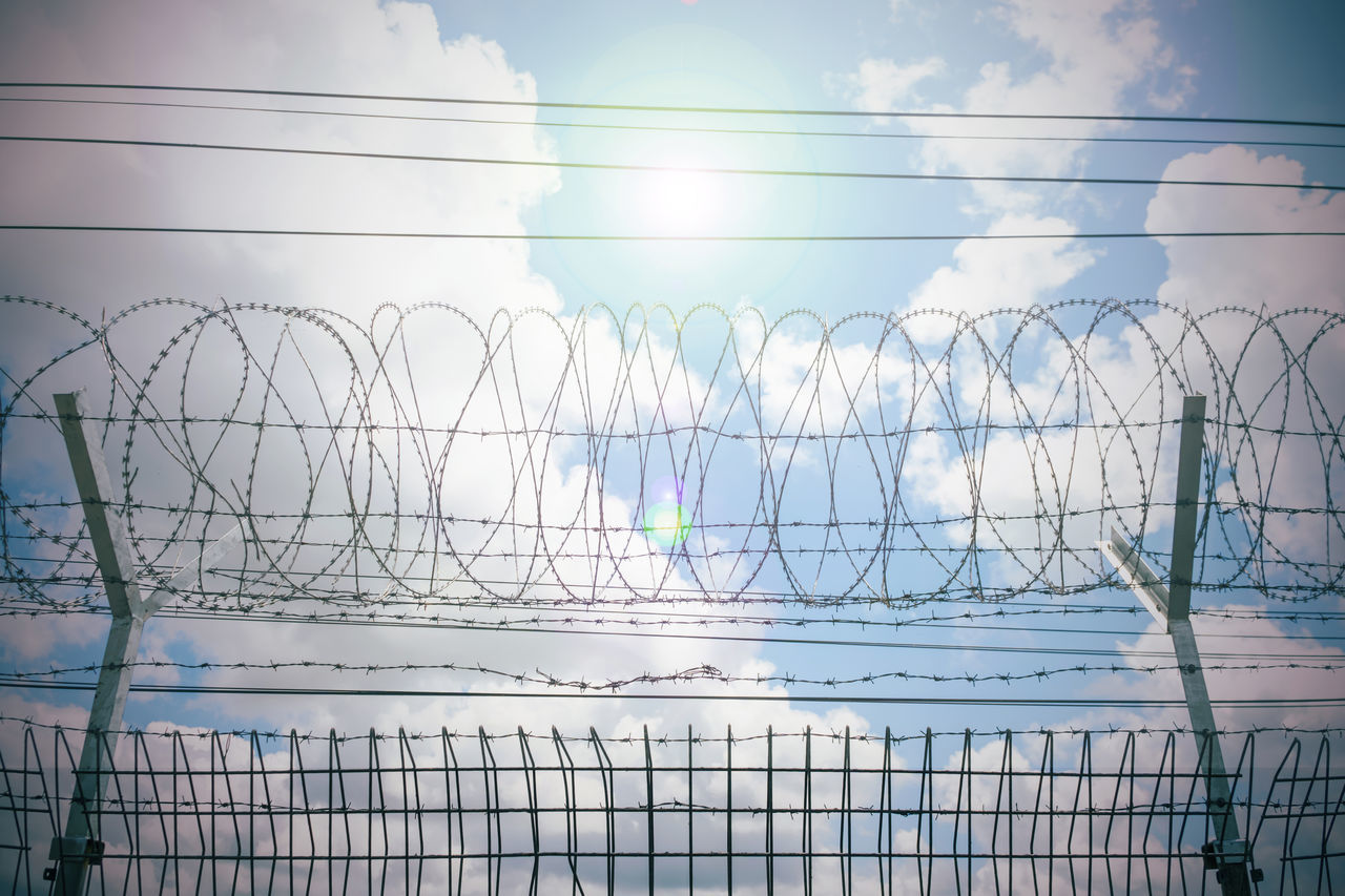 FENCE AGAINST SKY