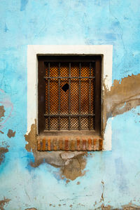 Low angle view of window on old building