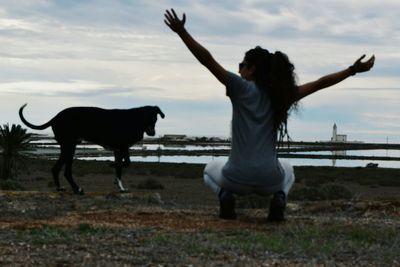 Rear view of man and woman against sky