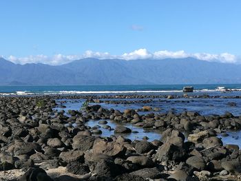 Scenic view of sea against blue sky