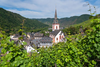 High angle view of trees and buildings against sky