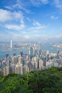 Aerial view of modern buildings in city against sky