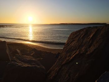 Scenic view of sea at sunset