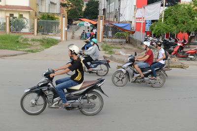 Bicycles parked on road in city