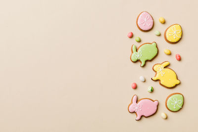 Directly above shot of pills on pink background