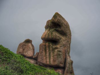 Low angle view of statue against sky