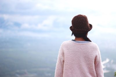 Rear view of woman against sky