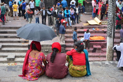 Women sitting outside the temple, nepal