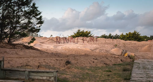 Panoramic view of arid landscape against sky