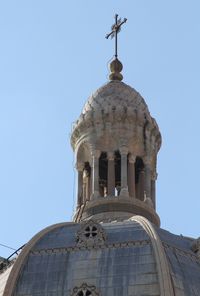 Low angle view of church against blue sky