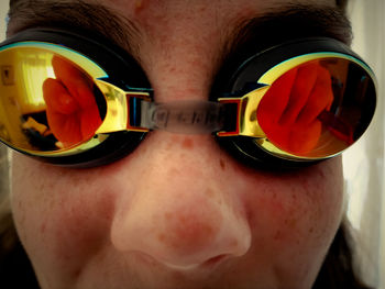 Close-up of boy wearing swimming goggles