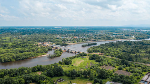 High angle view of river amidst landscape against sky