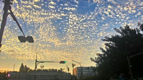 Low angle view of building against sky at sunset