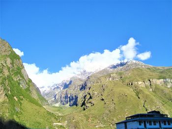 Panoramic view of landscape against blue sky