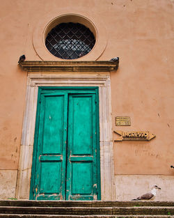 Low angle view of closed door of building