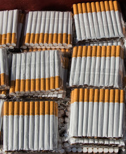 Close-up of cigarettes in row