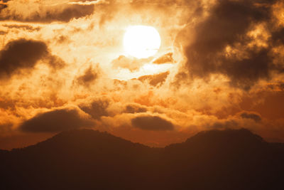 Low angle view of dramatic sky during sunset