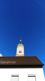 Low angle view of building against clear blue sky