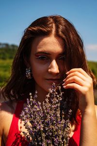 Portrait of beautiful young woman with blue eyes