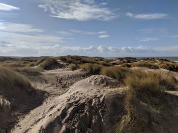 Panoramic view of desert against sky