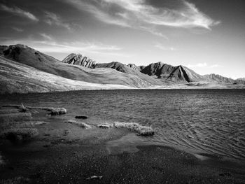 Scenic view of mountains against cloudy sky