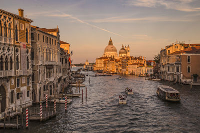 Canal passing through buildings in city