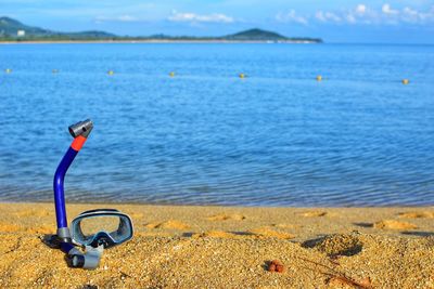 Close-up of toy on beach