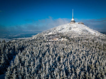 Scenic view of snow covered mountain against sky