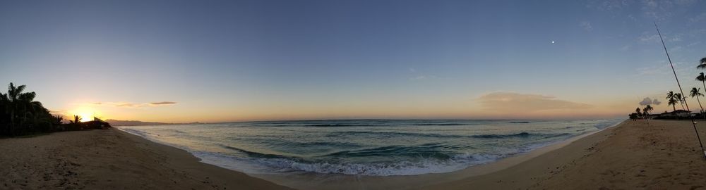 Scenic view of beach against sky during sunset