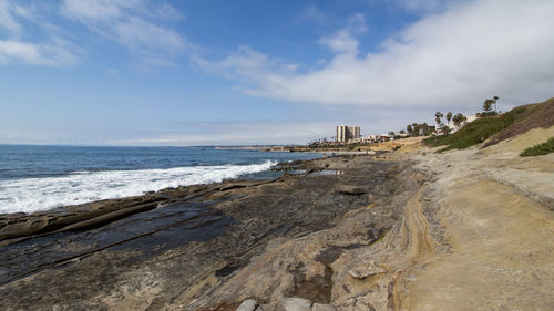 Scenic view of beach against sky