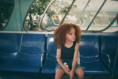 Girl sitting in train