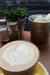 Close-up of cappuccino on table