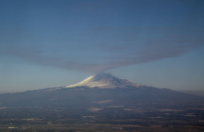 Scenic view of volcanic mountain against sky