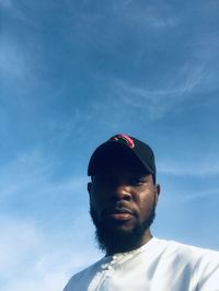 Low angle view of man standing against sky